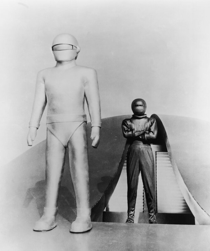 Two figures in futuristic suits