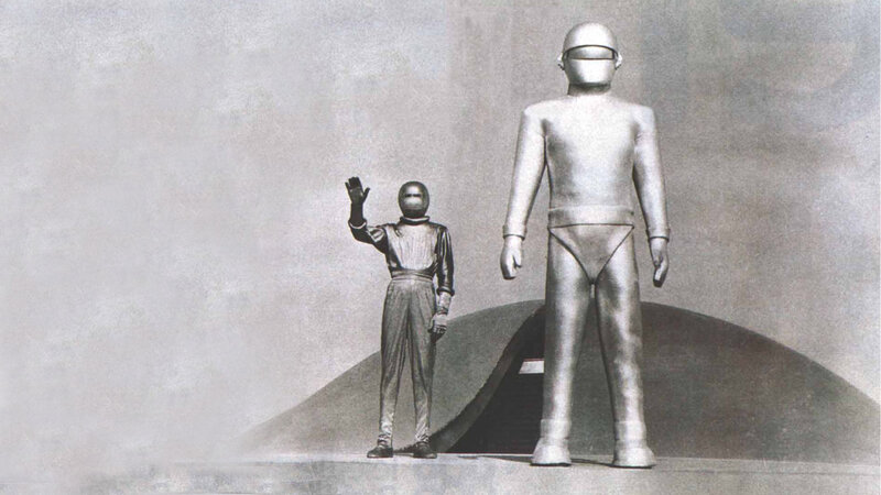 Two figures in futuristic suits