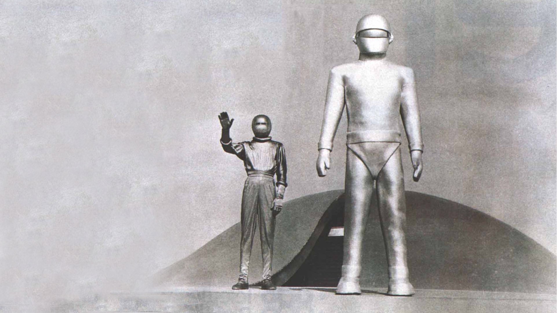Two figures in futuristic suits