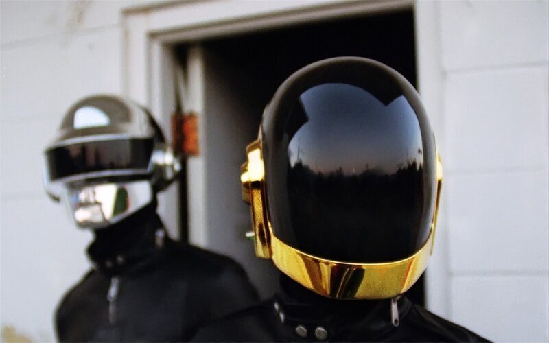 Two Figures in Helmets — Black, Dramatic, Sunset, Photograph, Doorway