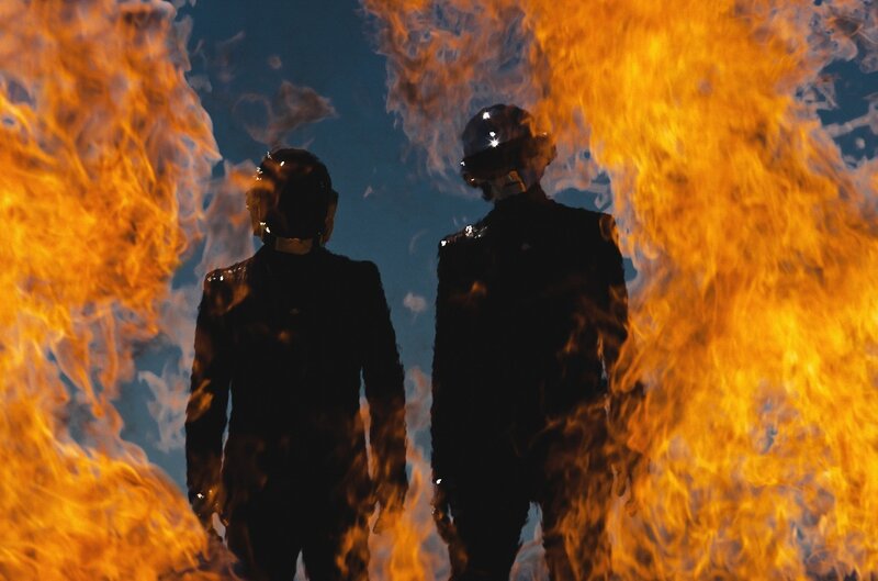Two Figures in Helmets — Orange, Dramatic, Photograph