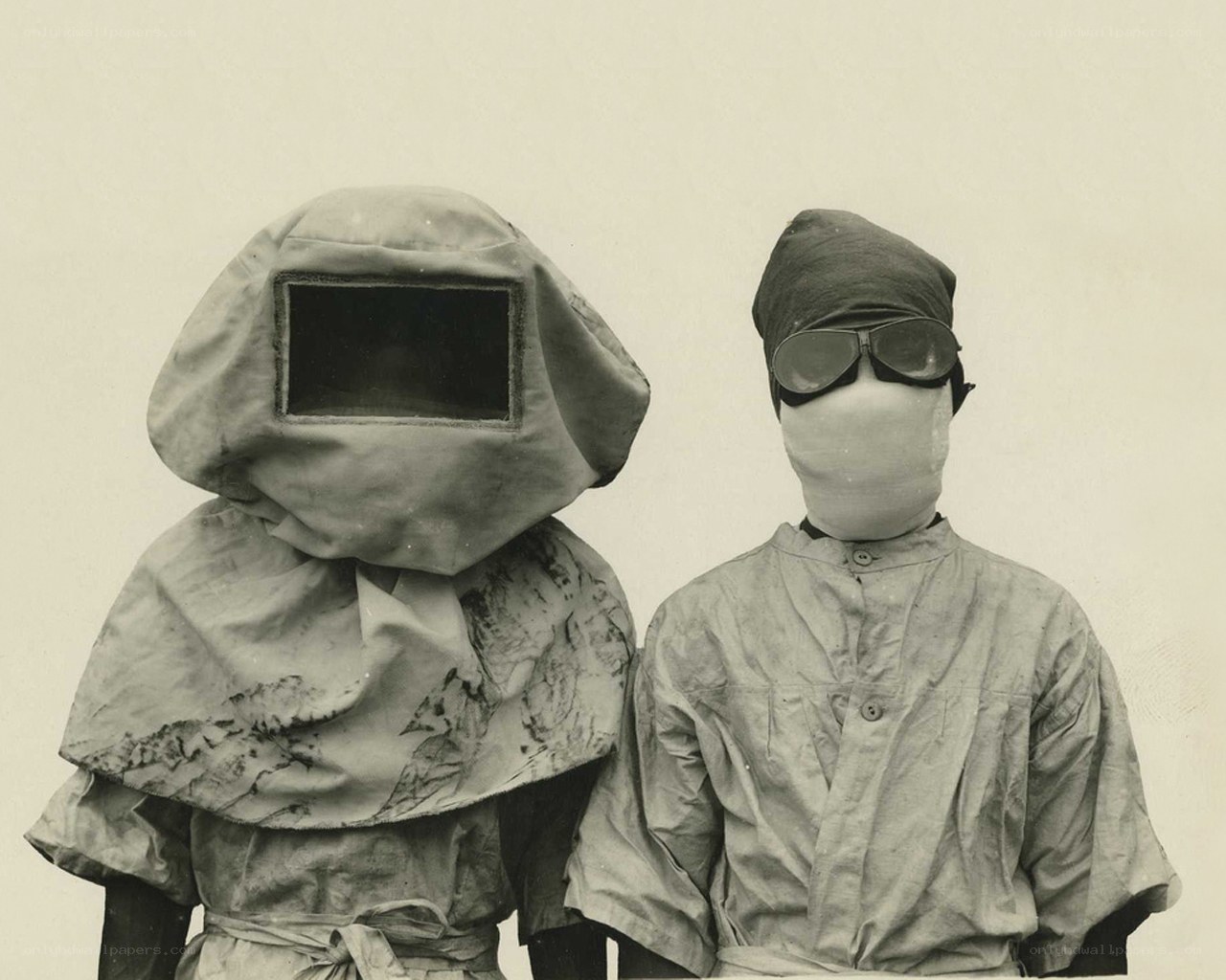 Two figures in protective gear