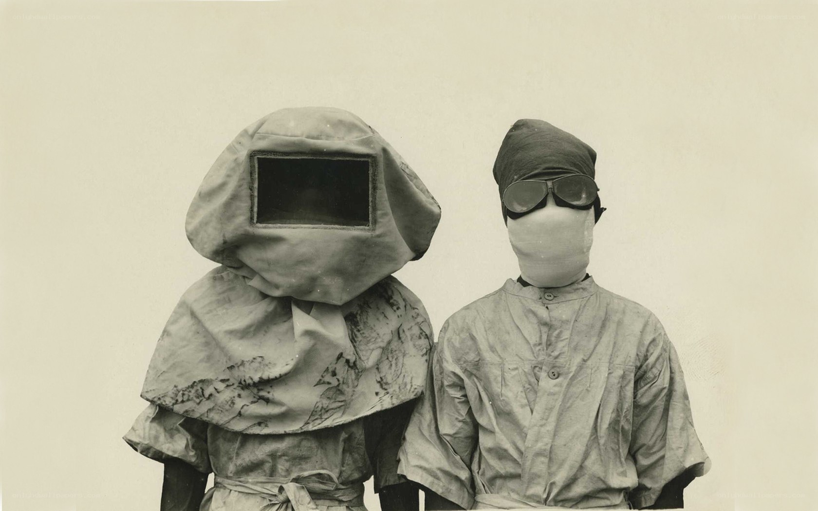 Two figures in protective gear