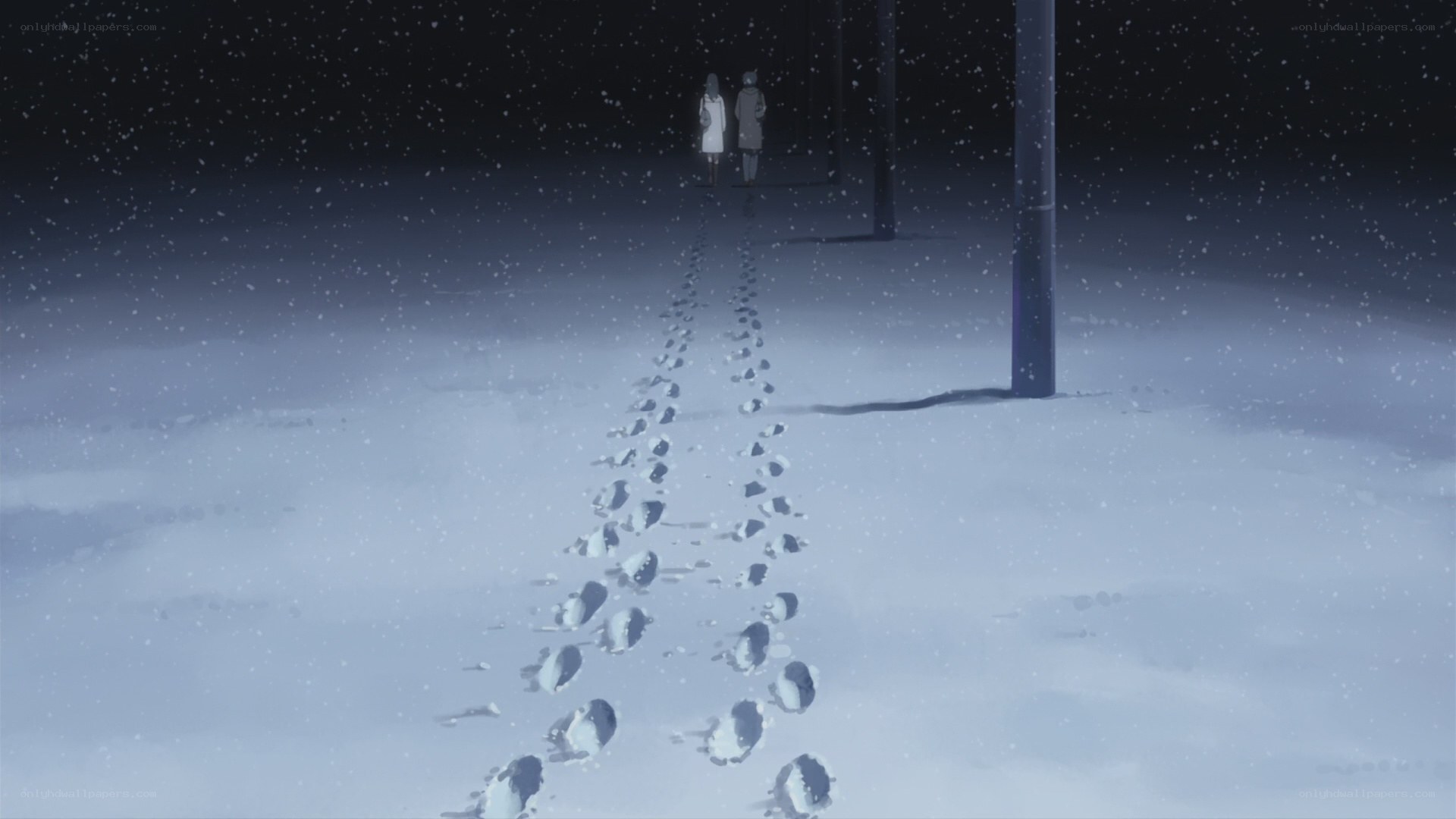 two figures in snowy night