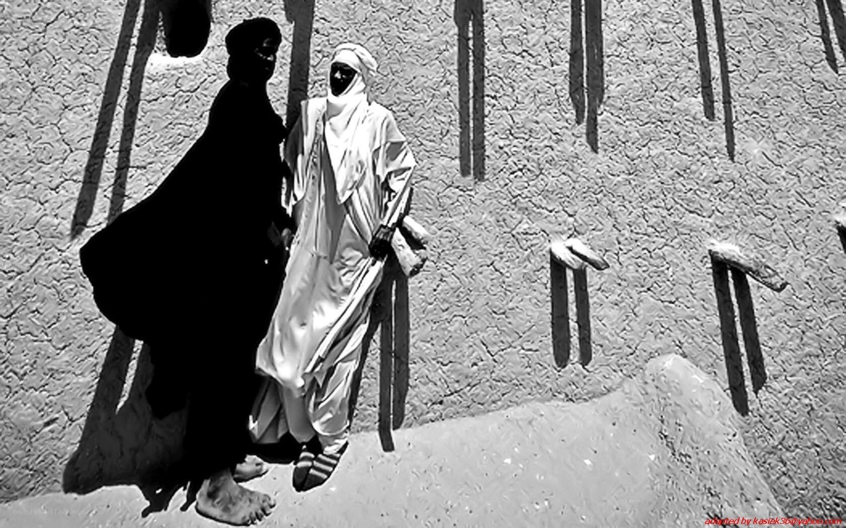 Two figures in traditional clothing