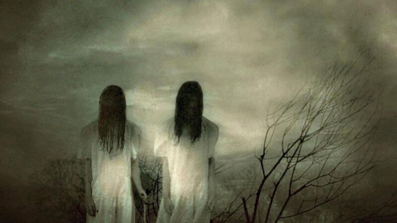 two figures in white dresses