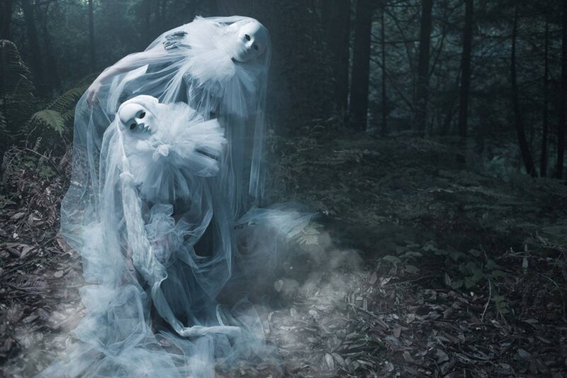 Two Figures in White Masks