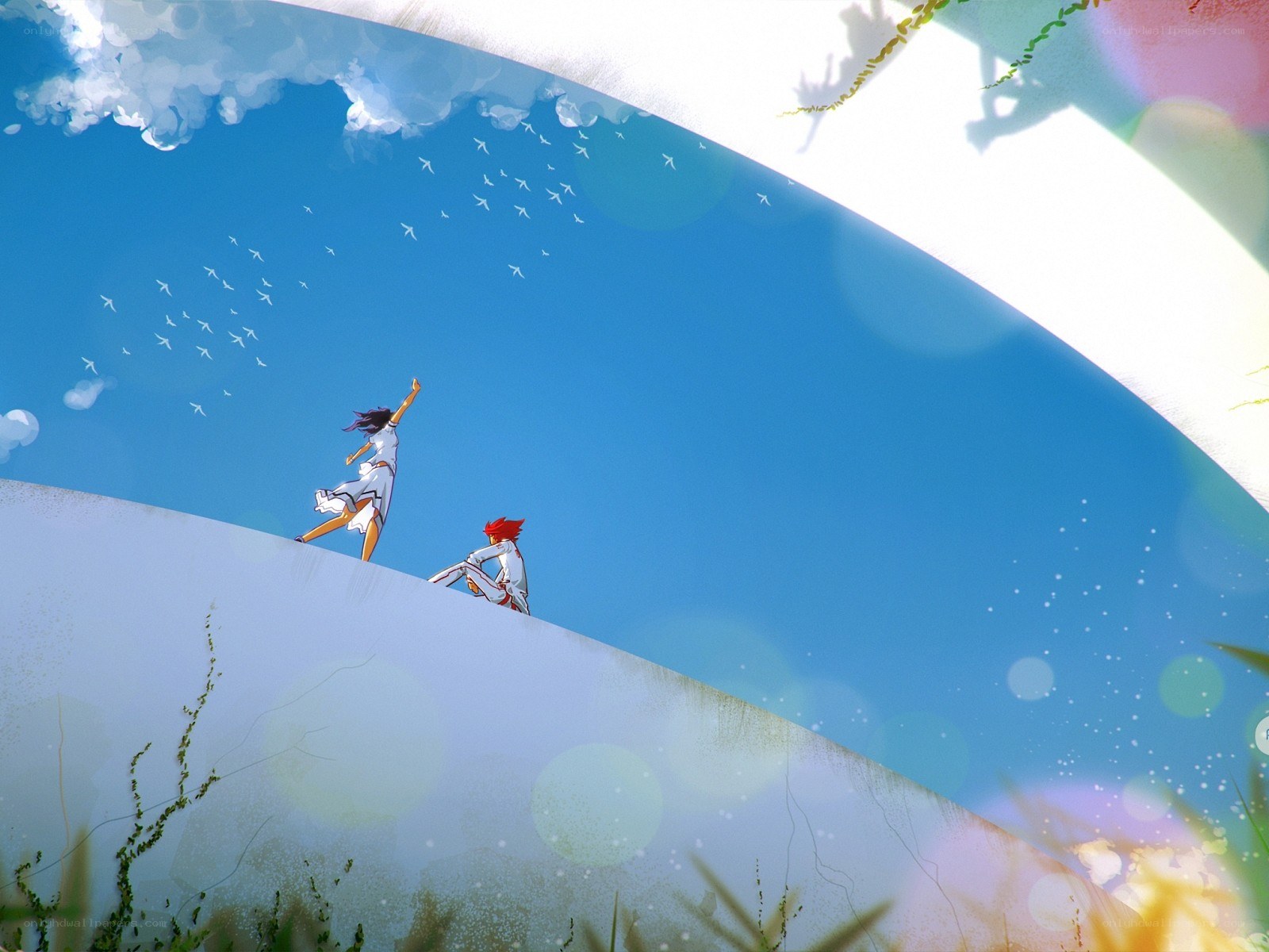 Two figures on a hill under blue sky