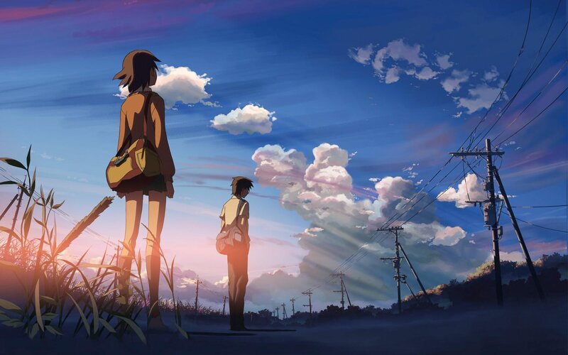 Two figures on a road at sunset