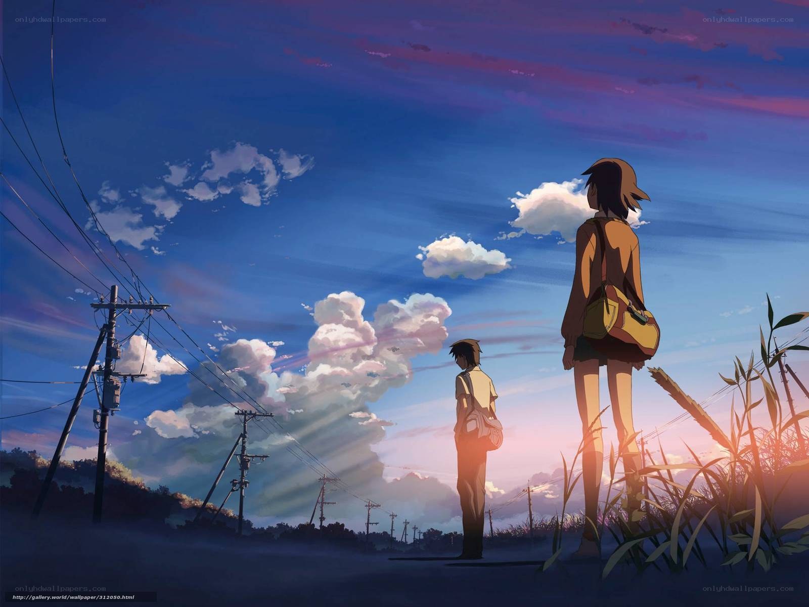 Two figures watch the sunset