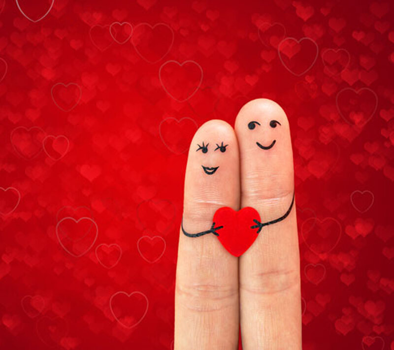Two Fingers Holding Heart