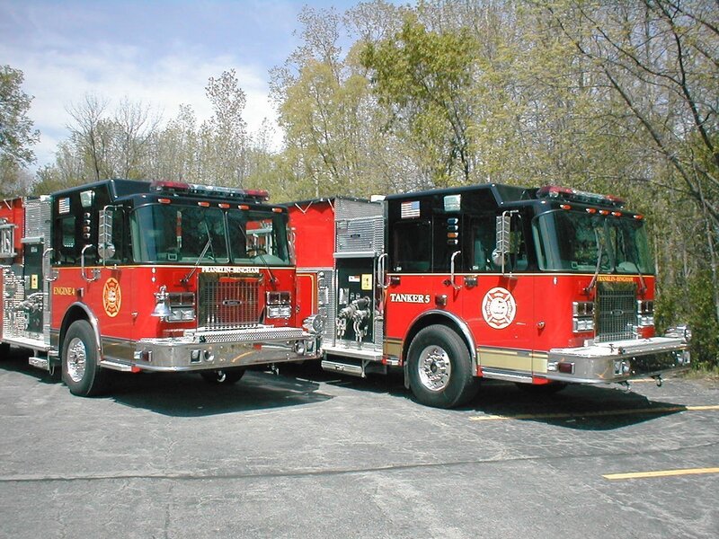 Two fire trucks parked side by side