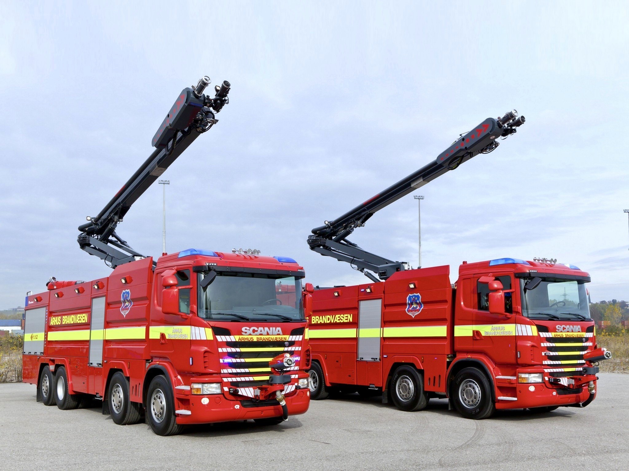 Two fire trucks with ladders
