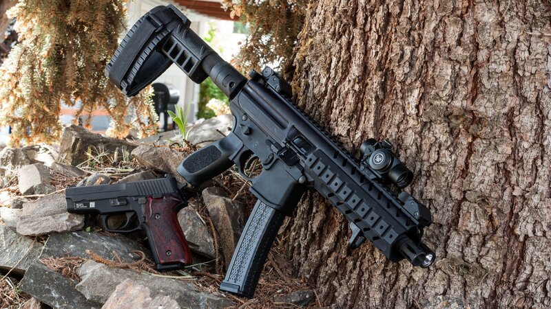 Two Firearms on Rocks
