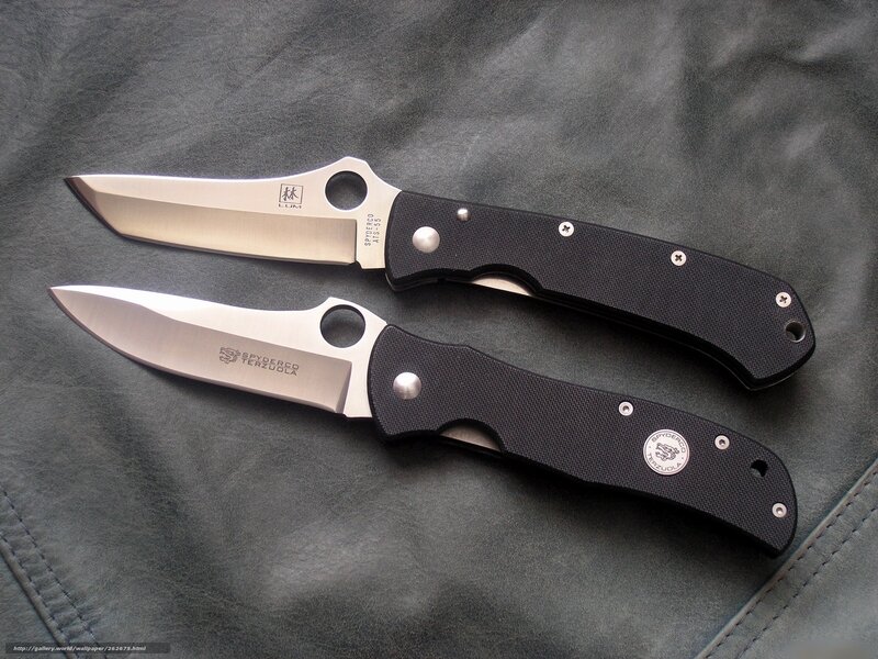 Two folding knives on leather