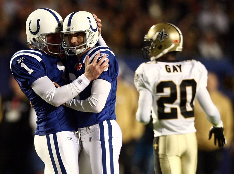 Two Football Players Hugging