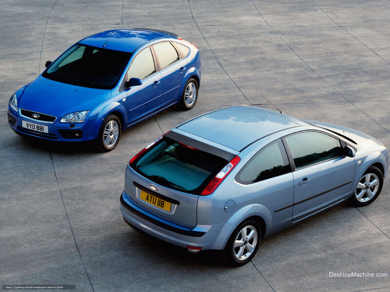 Two Ford Focus cars on pavement