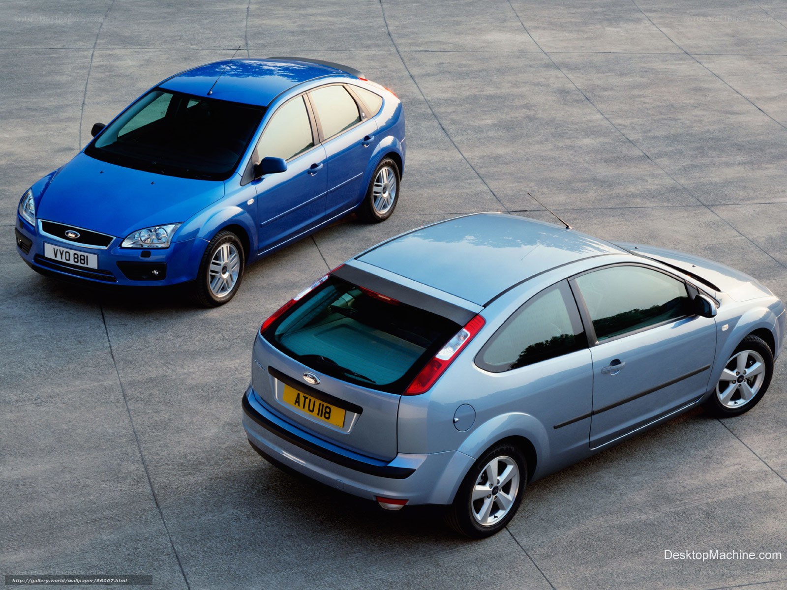 Two Ford Focus cars on pavement