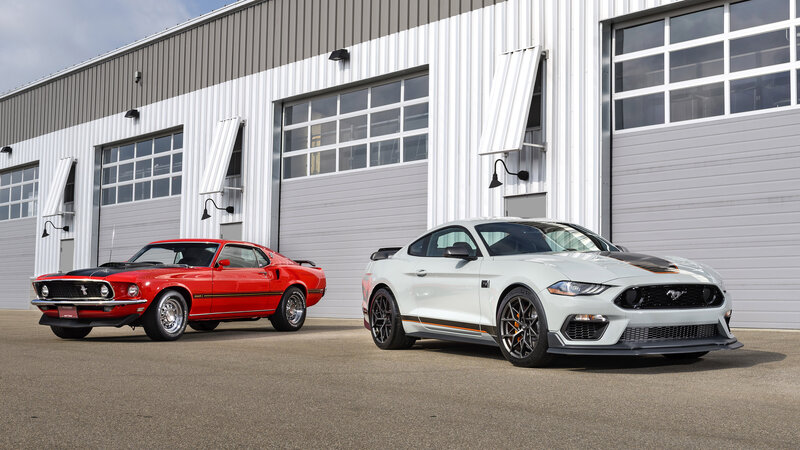 Two Ford Mustang Cars — Red