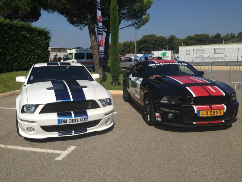 Two Ford Mustang Cars — White, Outdoor