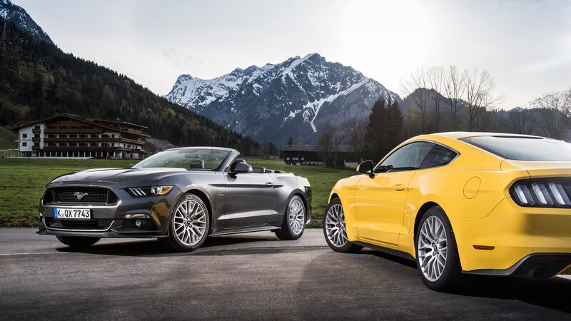 Two Ford Mustang Cars — Yellow