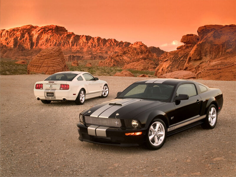 Two Ford Mustangs in desert