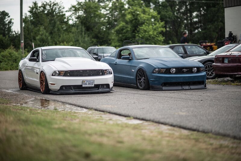 Two Ford Mustangs parked