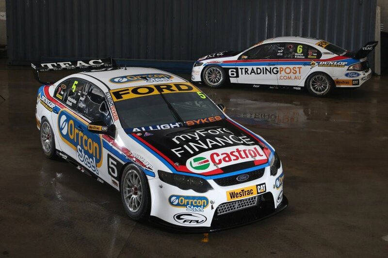 Two Ford racing cars in garage