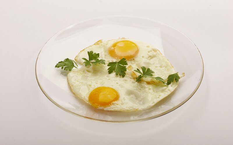 two fried eggs on a plate