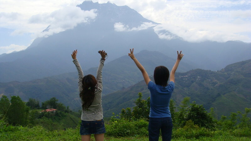 Two friends at a mountain viewpoint