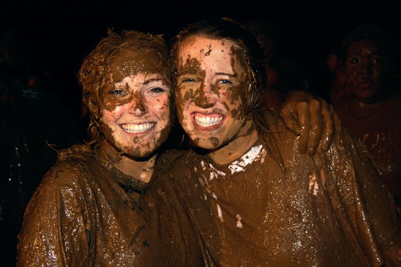 Two friends covered in mud