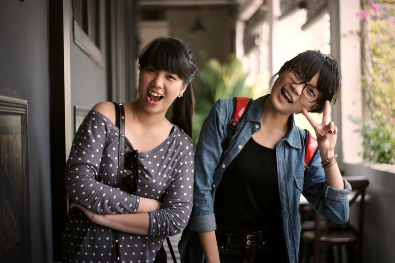 Two friends posing outdoors