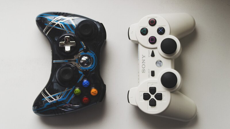 Two gaming controllers side by side