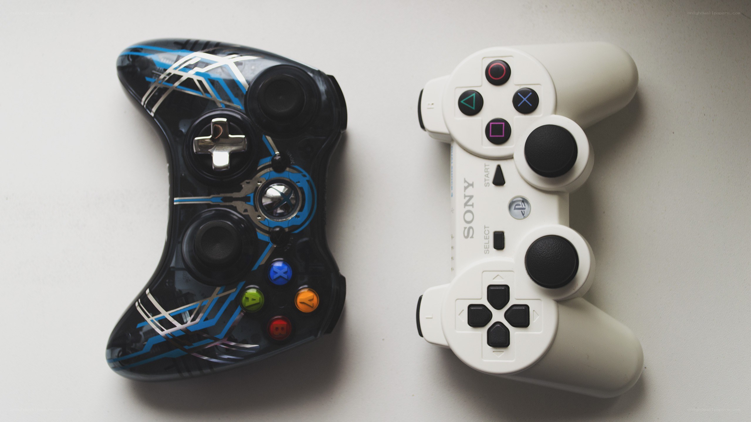 Two gaming controllers side by side
