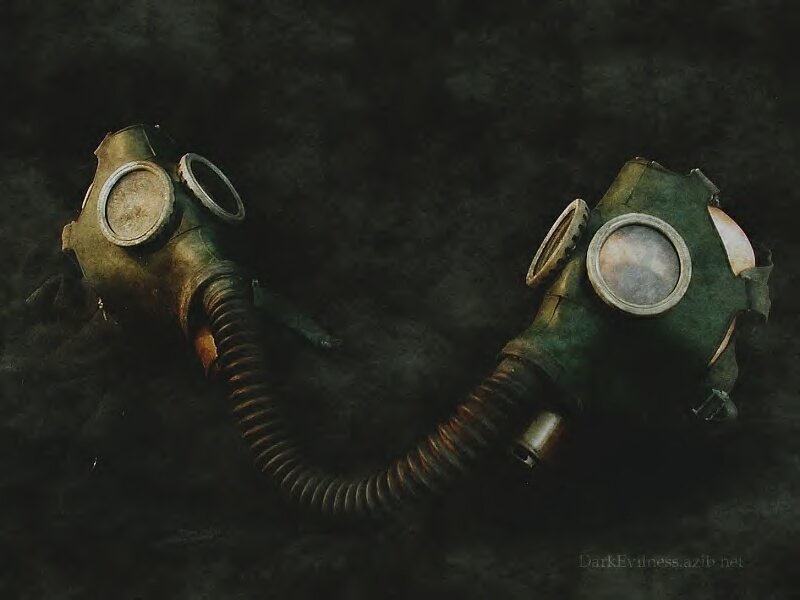 two gas masks on dark surface