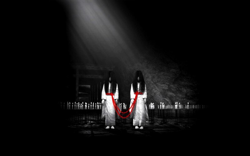 Two ghostly figures in a dark room
