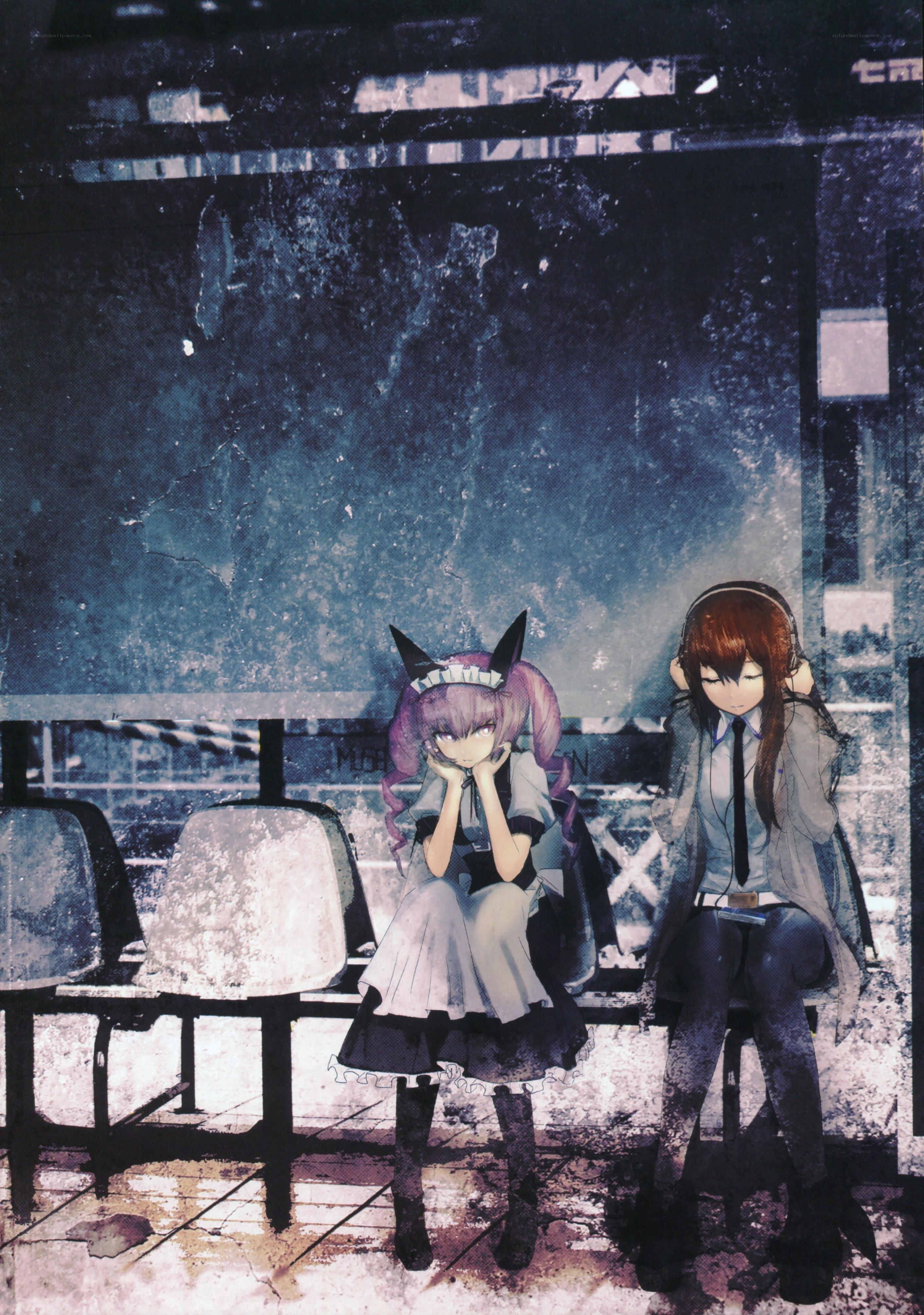 Two girls at a bus stop