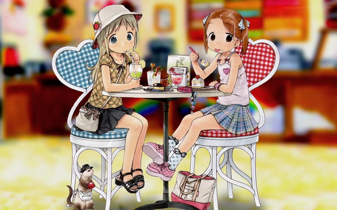 Two girls at a cafe table