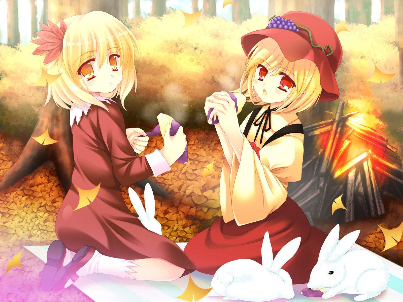 Two girls at a campfire