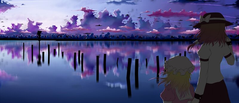 Two girls at a lake at dusk