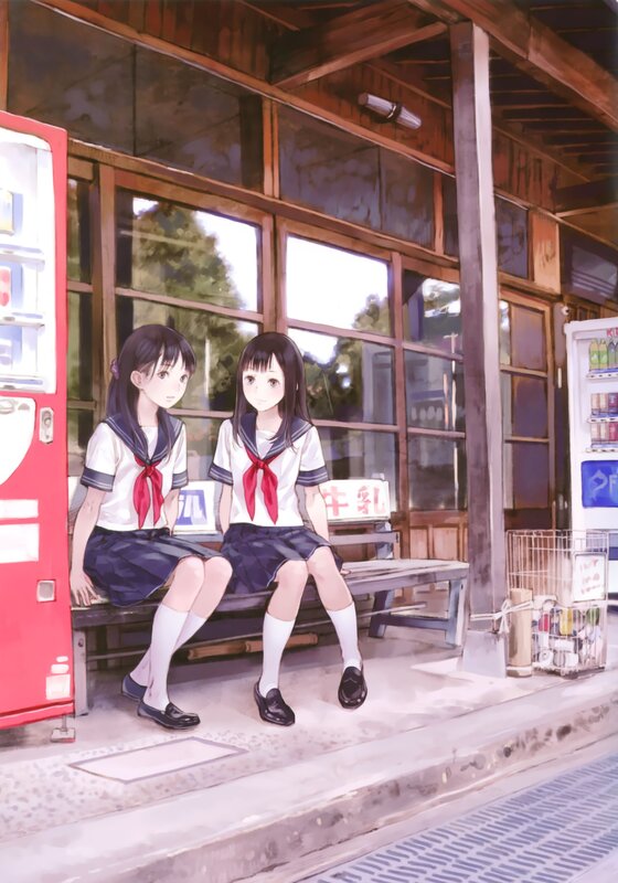 Two girls at a train station