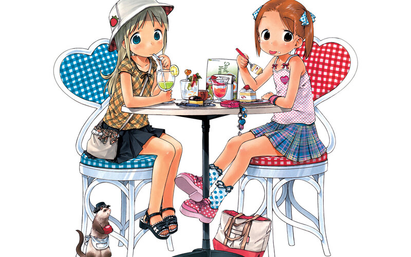 Two Girls at Cafe Table