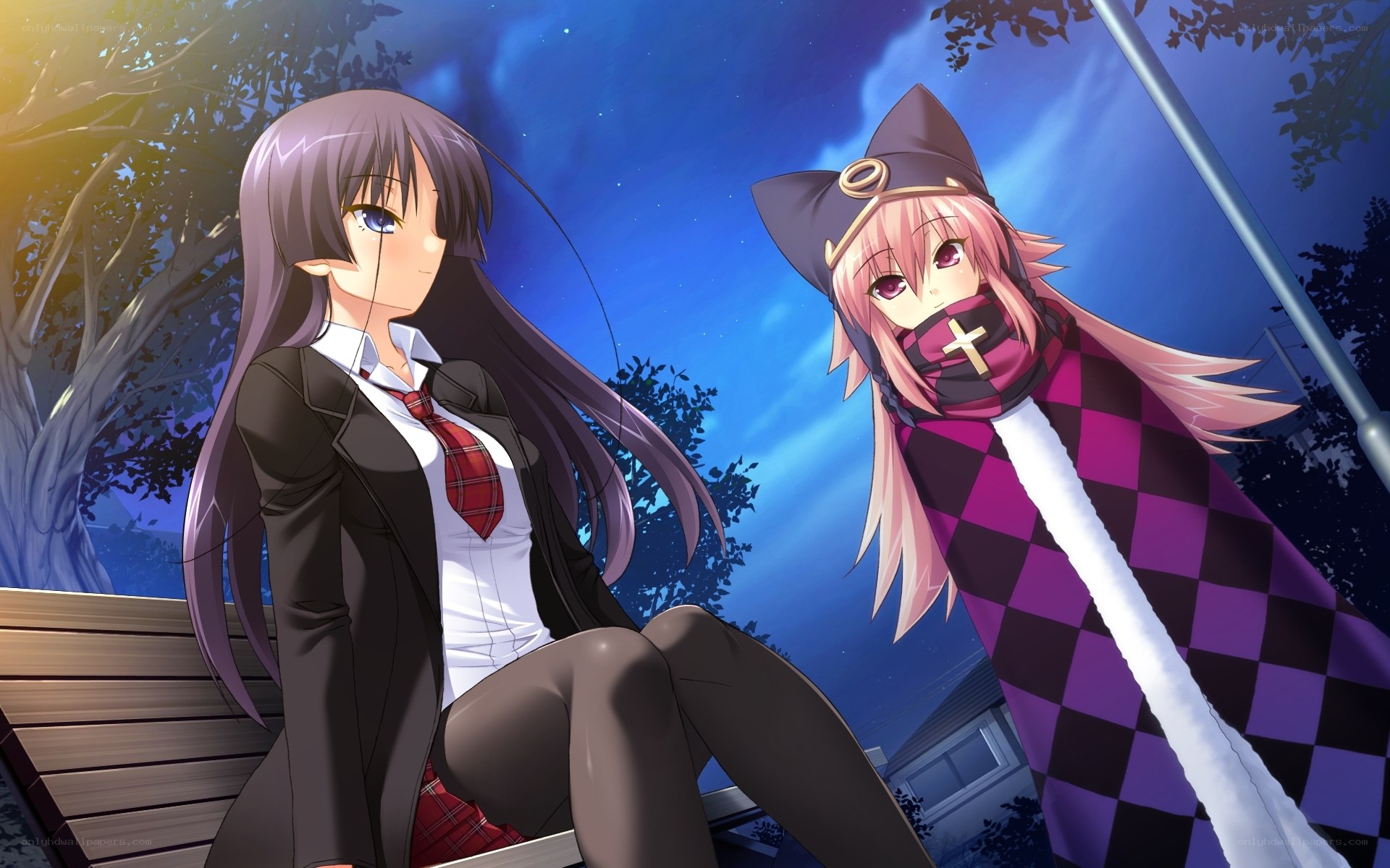 Two girls at night on a bench