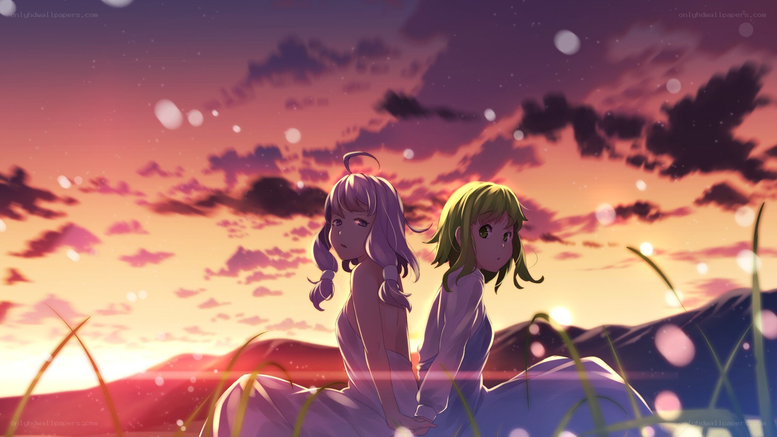 two girls at sunset