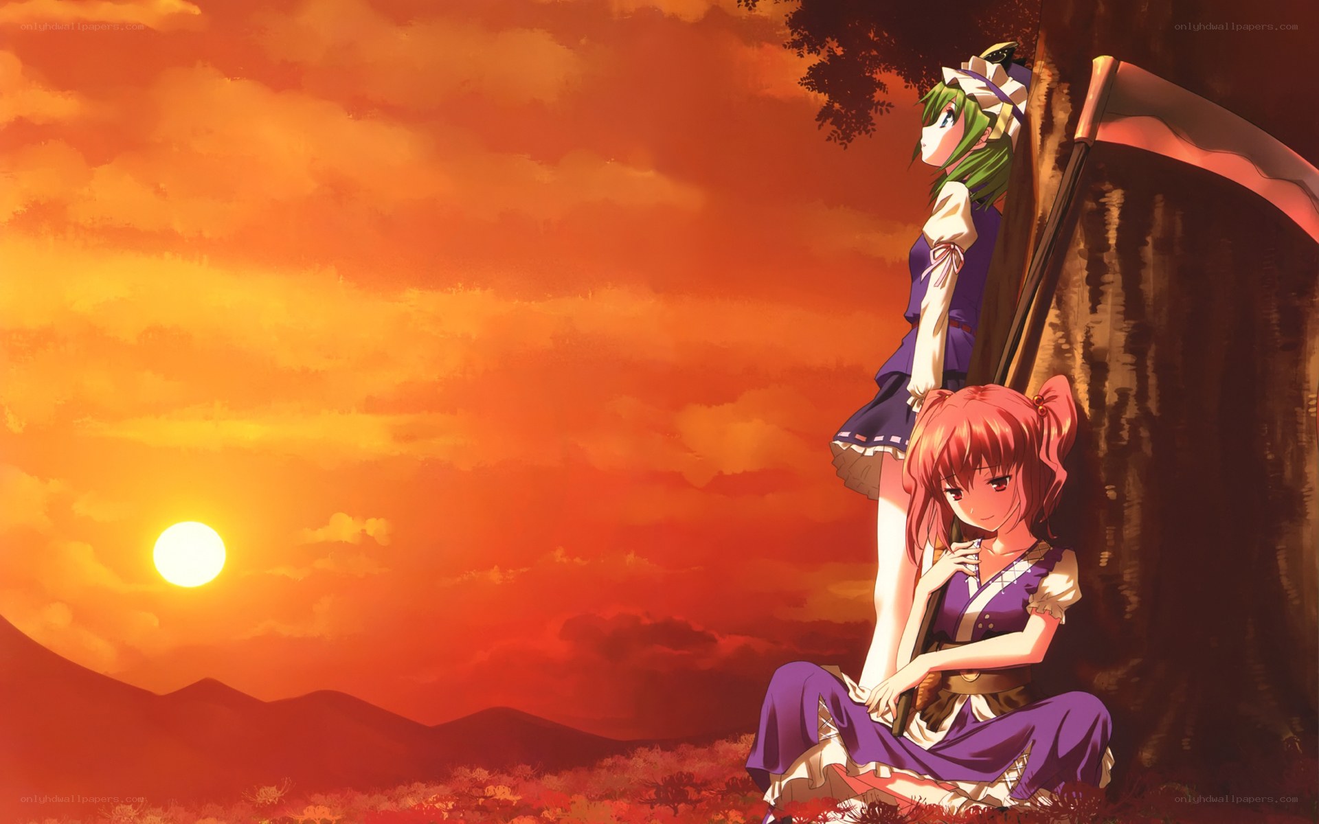Two girls at sunset by a tree