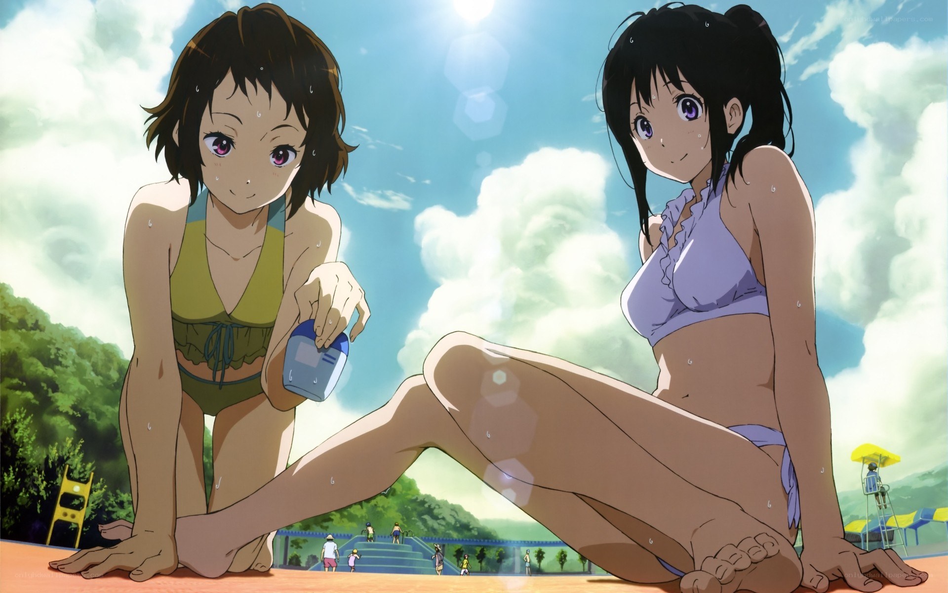 Two girls at the poolside