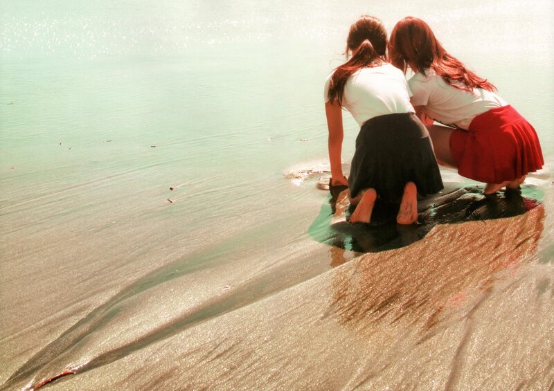 Two girls at the water's edge