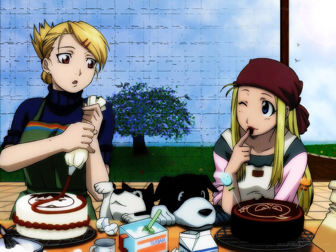 Two girls baking cakes