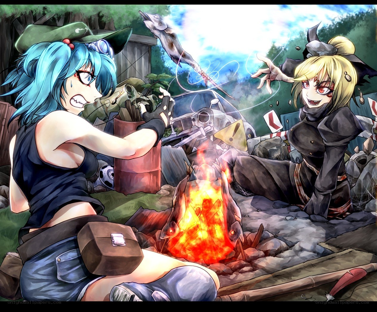 Two girls by a campfire