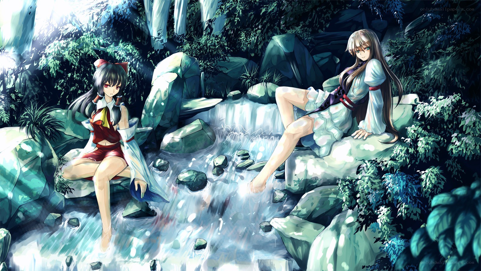 Two girls by a forest stream